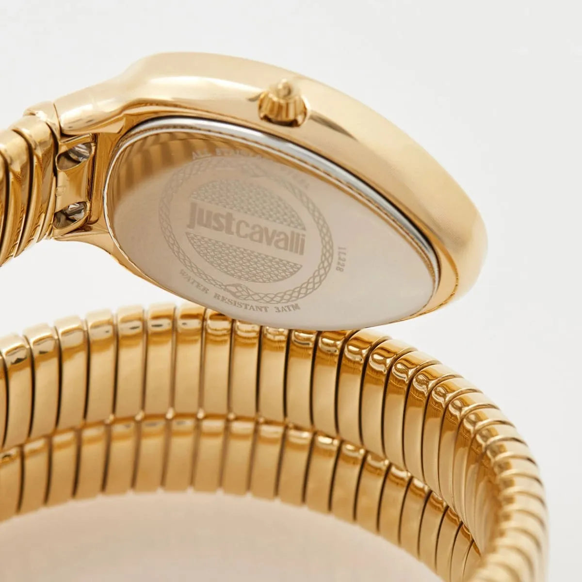 Gold watch caseback showing Just Cavalli branding and water-resistant case detail