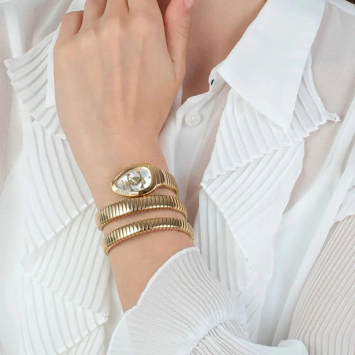 Gold Just Cavalli watch on wrist with triple-wrap snake strap worn on white sleeve