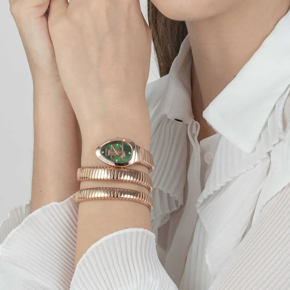 Just Cavalli Snake green watch worn on wrist with rose gold snake strap