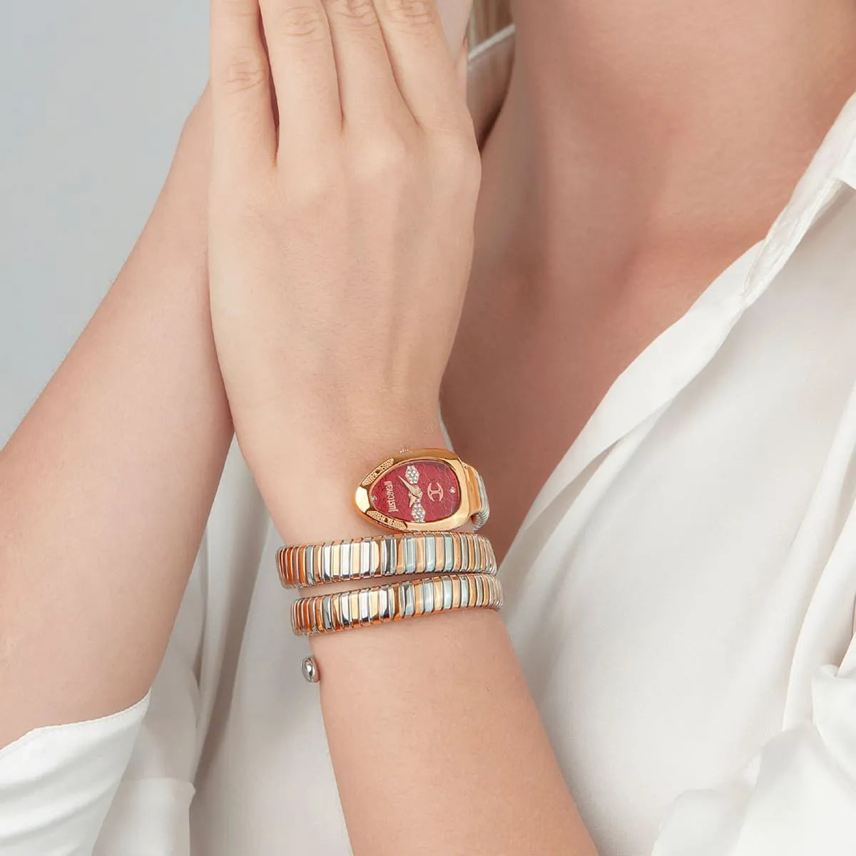 Just Cavalli Cosenza watch on wrist with two-tone triple-wrap snake strap