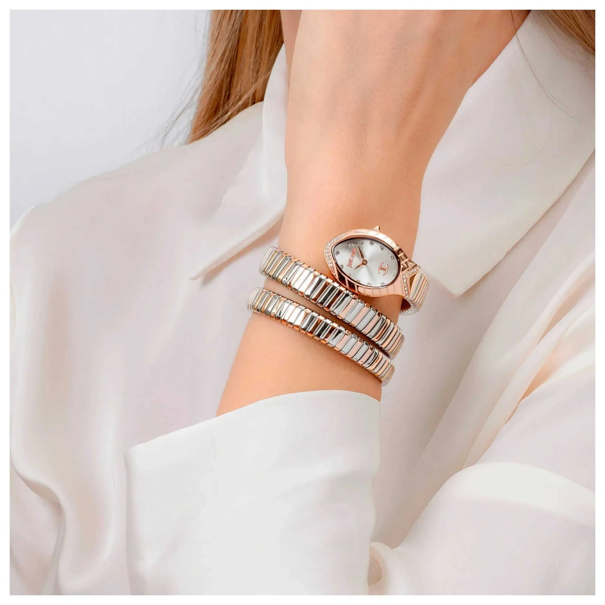 Just Cavalli lungo women's watch worn with expandable strap bracelets