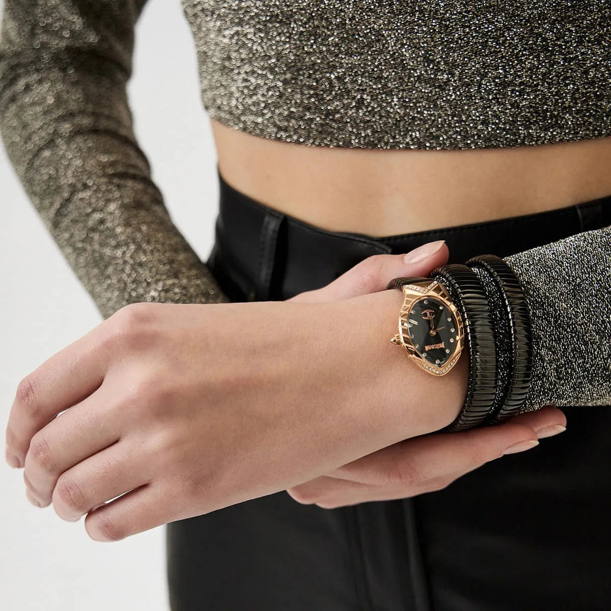Just Cavalli Classico Lungo watch worn on wrist, displaying rose gold case with triple-wrap black snake strap
