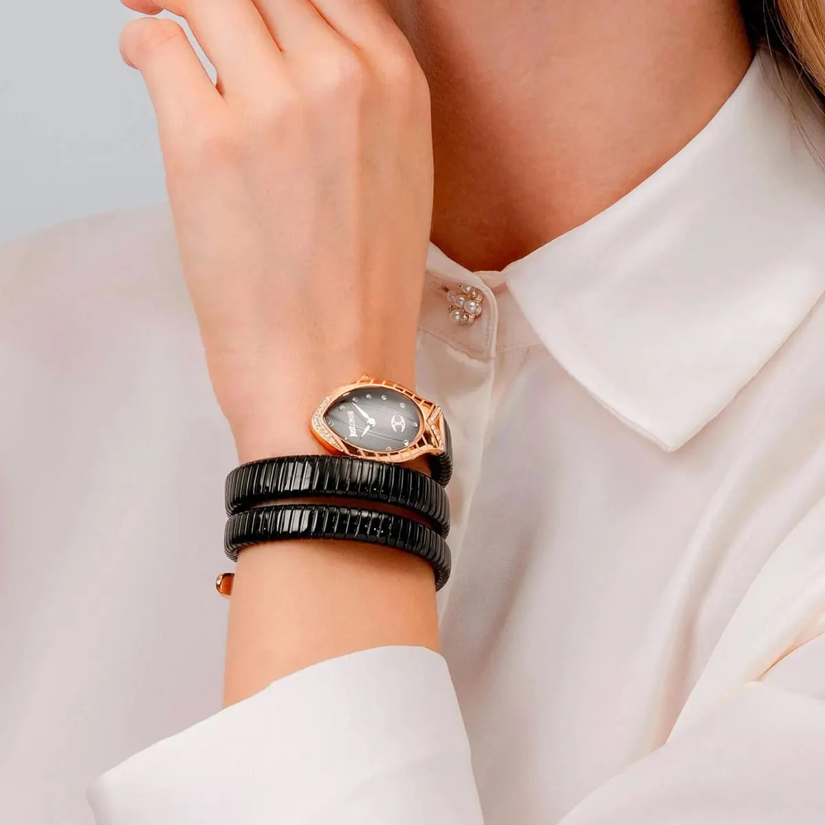 Just Cavalli Classico Lungo women's watch on wrist with black triple-wrap snake strap and rose gold case