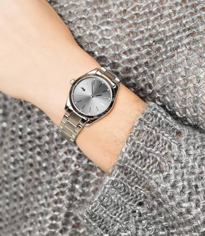 Lacoste 2001081 women's watch worn on wrist showing grey dial and stainless steel case
