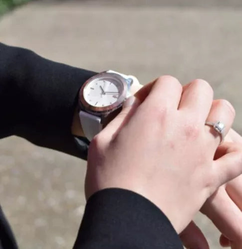 Lacoste women's watch on wrist, white dial with rose gold accents