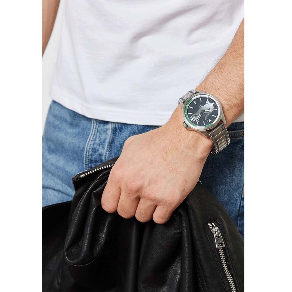 Lacoste Capbreton watch worn on wrist with grey dial and stainless steel bracelet