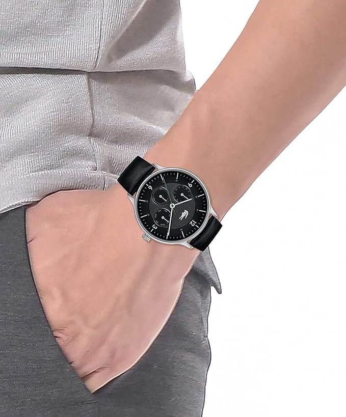 Lacoste Moon Multi chronograph watch worn on wrist showing black dial and black leather strap