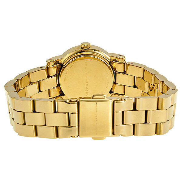 Gold tone case back of Amy watch showing crown and solid case construction
