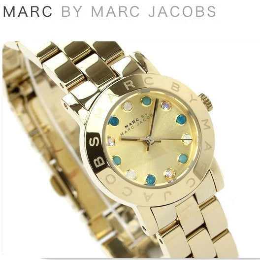 Marc By Marc Jacobs Amy watch displayed on wrist angle with multicolor crystals and gold bracelet