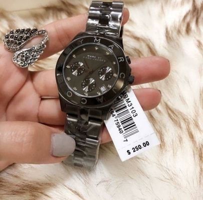 Marc Jacobs Blade MBM3083 chronograph watch worn on wrist with price tag visible