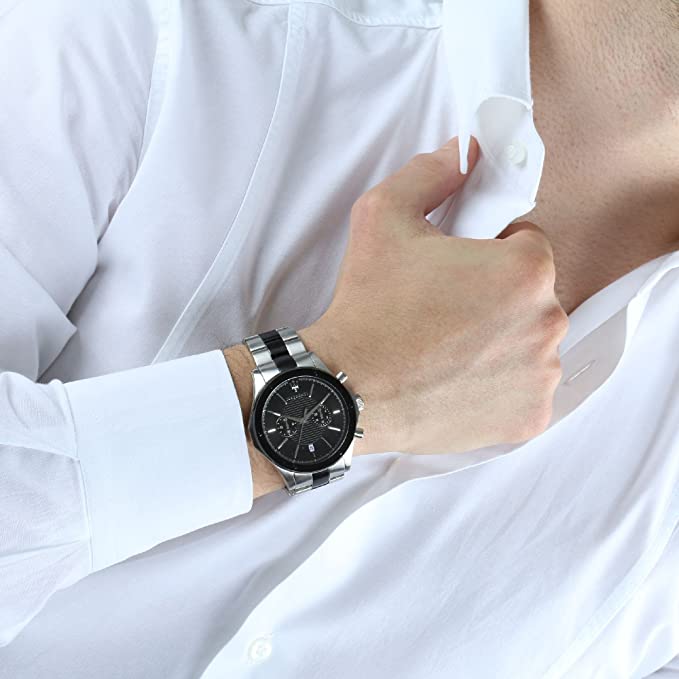 Maserati chronograph watch worn on wrist with white dress shirt