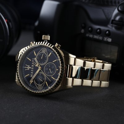 Angled view of Maserati Competizione chronograph with blue dial and gold stainless steel case