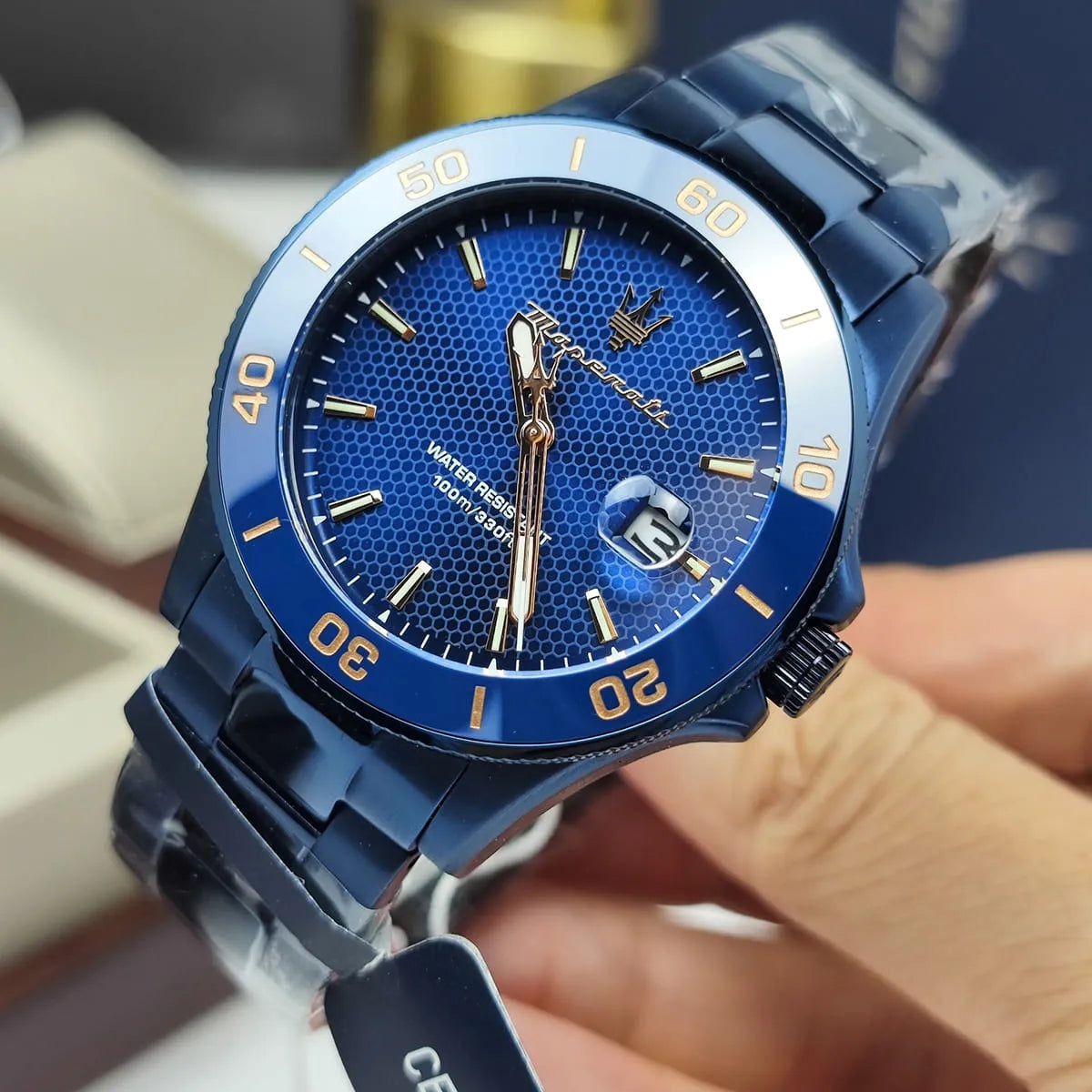 Maserati Competizione men's watch on wrist with blue sunburst dial and steel links