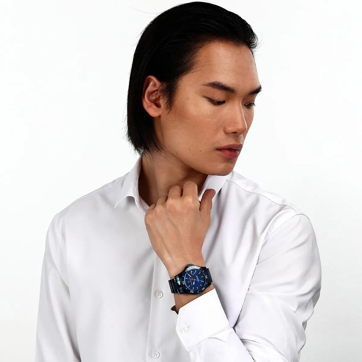 Maserati Competizione quartz watch worn on wrist with blue dial and steel band