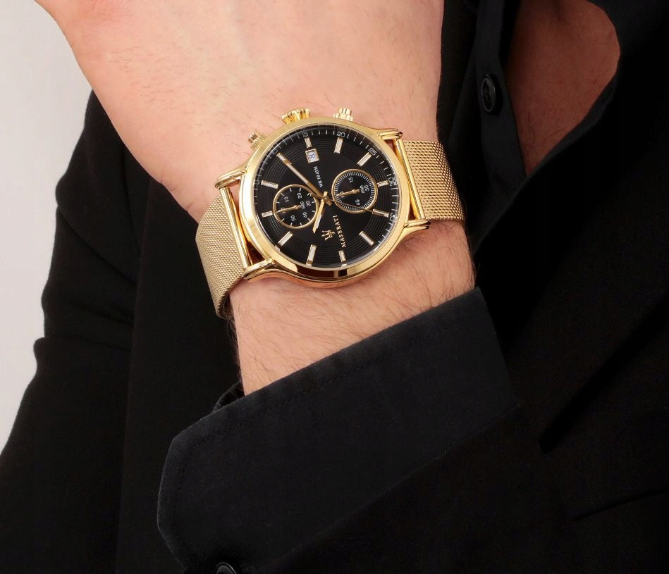 Maserati Epoca 42mm gold mesh watch on wrist showing gold case and dial