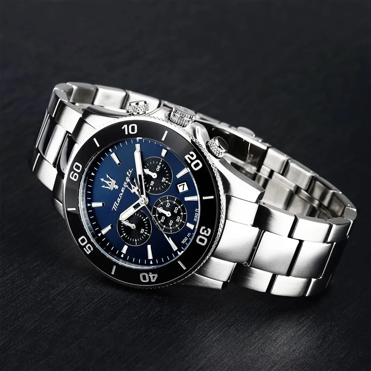 Maserati Competizione watch with blue chronograph dial and stainless steel case on dark background