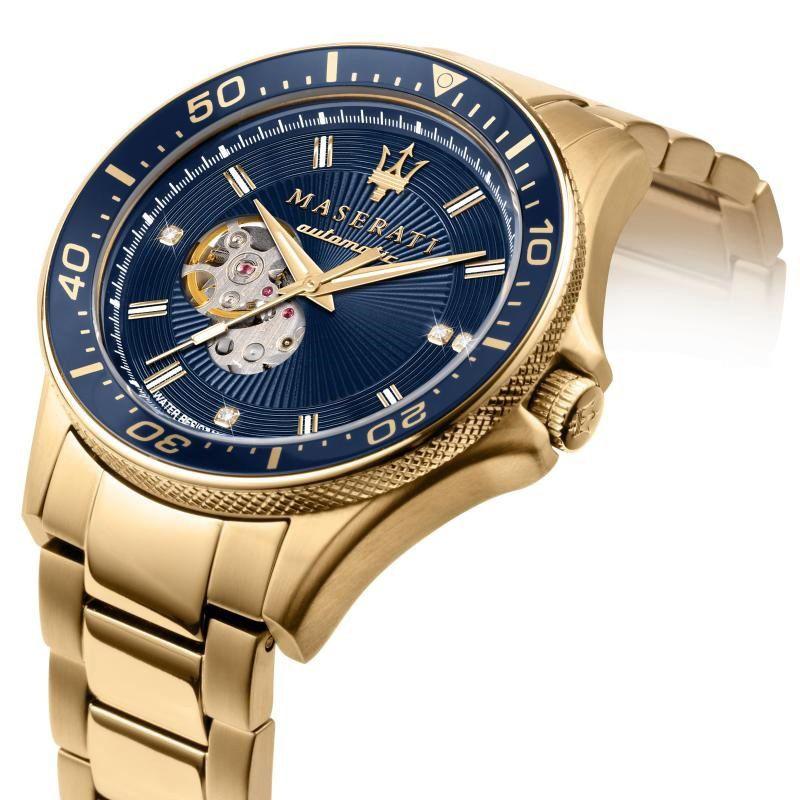 Angle view of Maserati Sfida watch showing gold case and navy skeleton dial