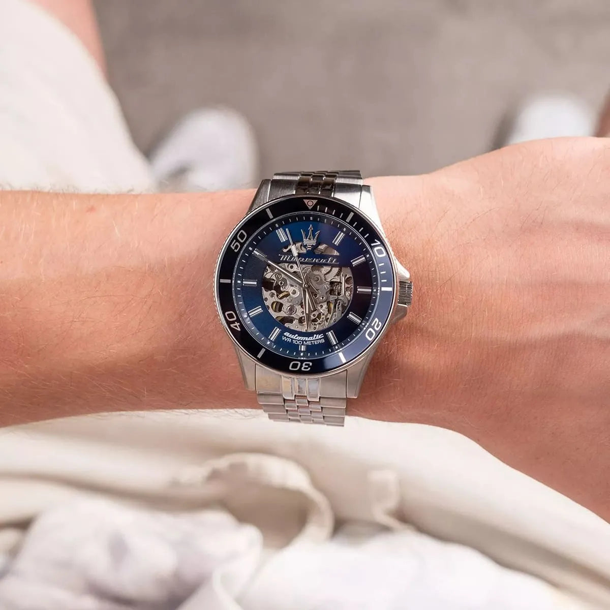 Maserati Sfida skeleton automatic watch worn on wrist with blue dial visible