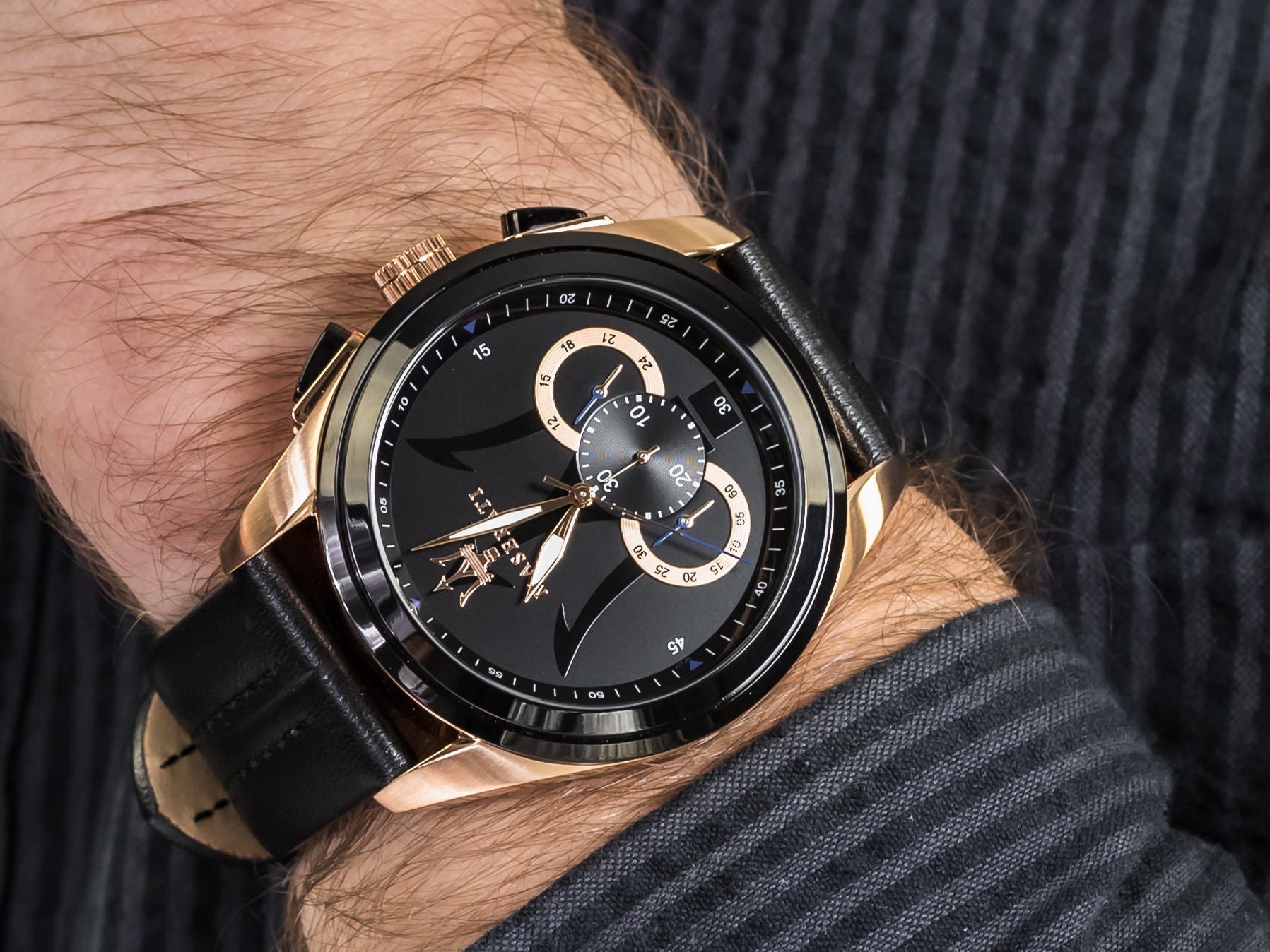 Maserati Traguardo chronograph watch worn on wrist, displaying black dial with rose gold hands and subdials