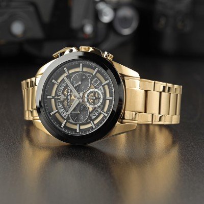 Maserati Traguardo watch angled view showing chronograph subdials and gold case