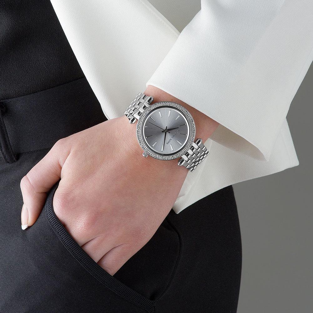 Michael Kors Darci silver-tone watch worn on wrist