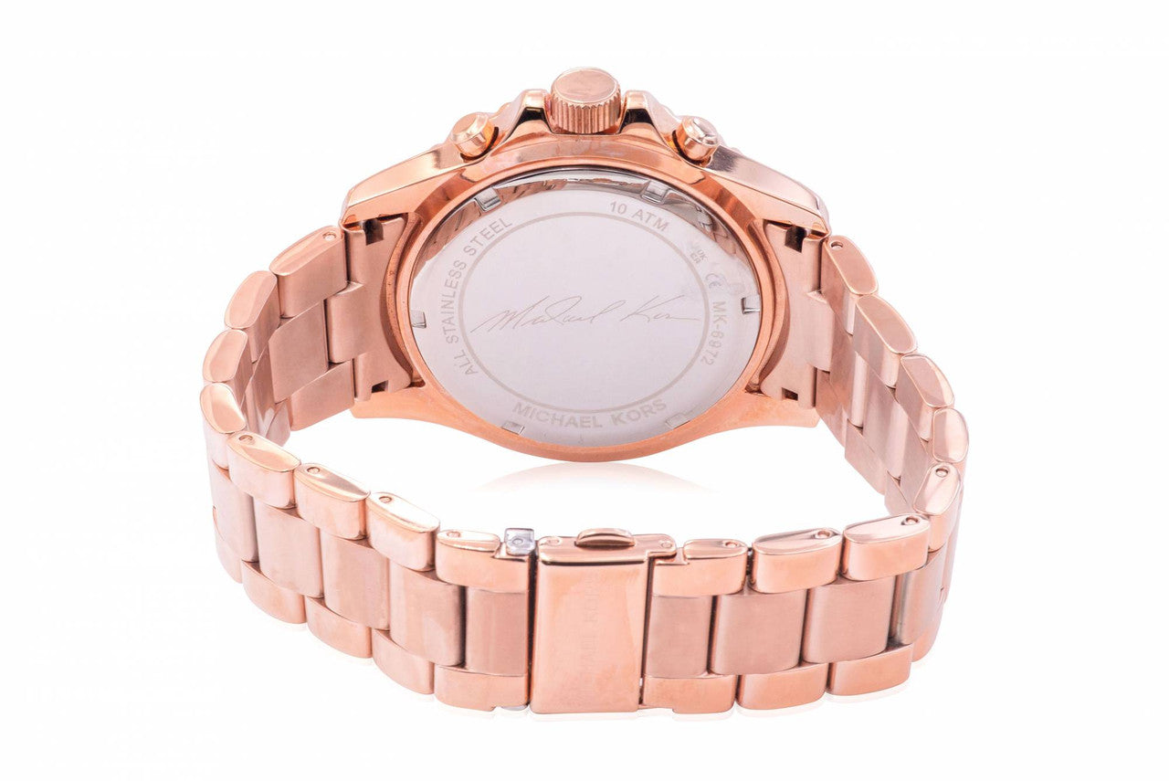 Michael Kors Everest rose gold-tone watch caseback showing engraved brand details