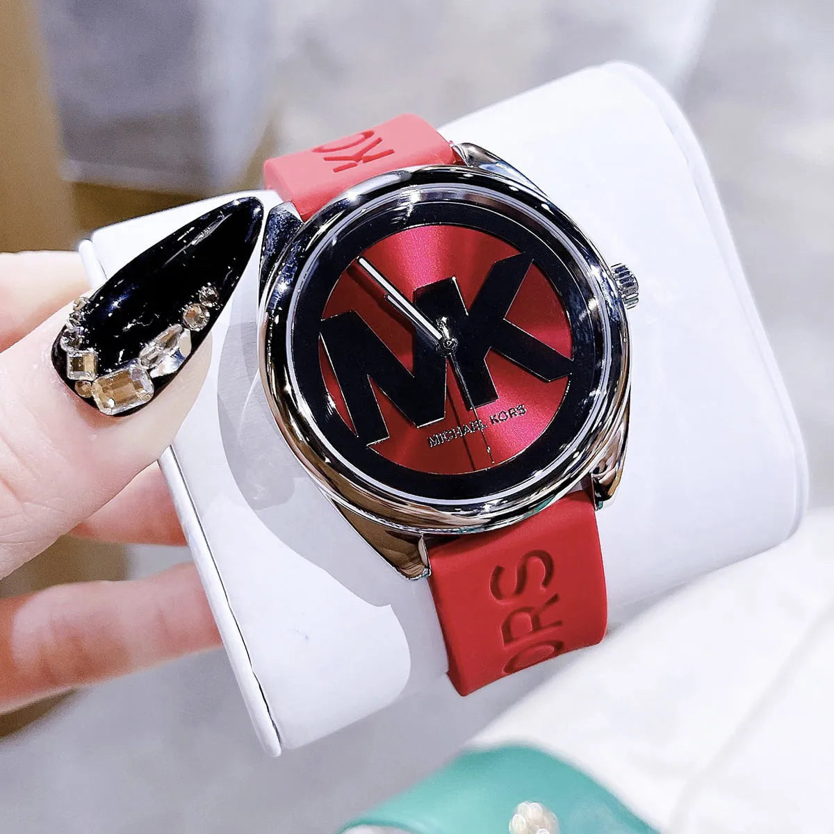 Michael Kors Janelle watch with red strap and MK7144 model documentation