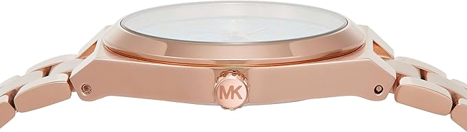 Side profile of Michael Kors Lennox rose gold watch case with MK logo crown