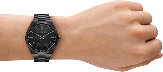 Michael Kors Lennox black watch on wrist with three-hand dial and matching bracelet