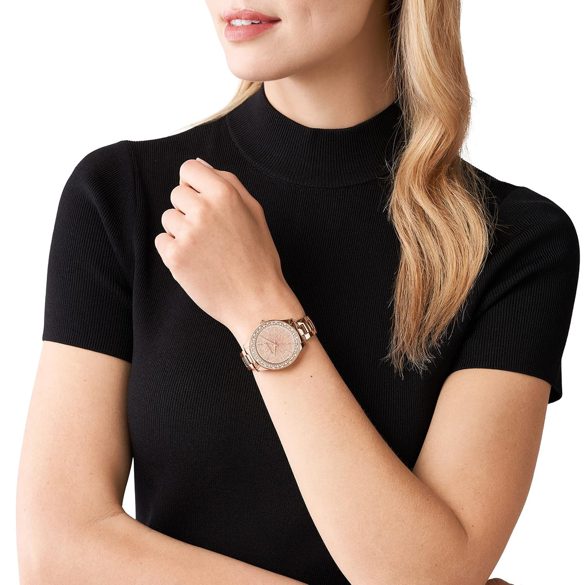 Michael Kors Liliane rose gold watch worn on wrist with crystal-embellished bezel
