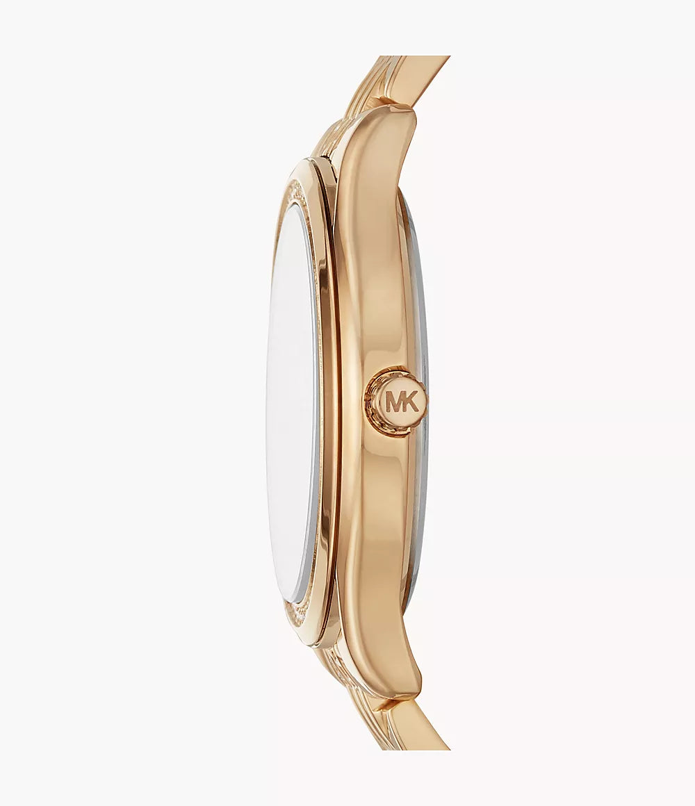 Michael Kors Mindy watch side profile showing gold-tone case and MK logo