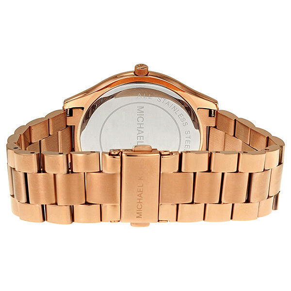 Rose gold bracelet strap and caseback of Michael Kors watch