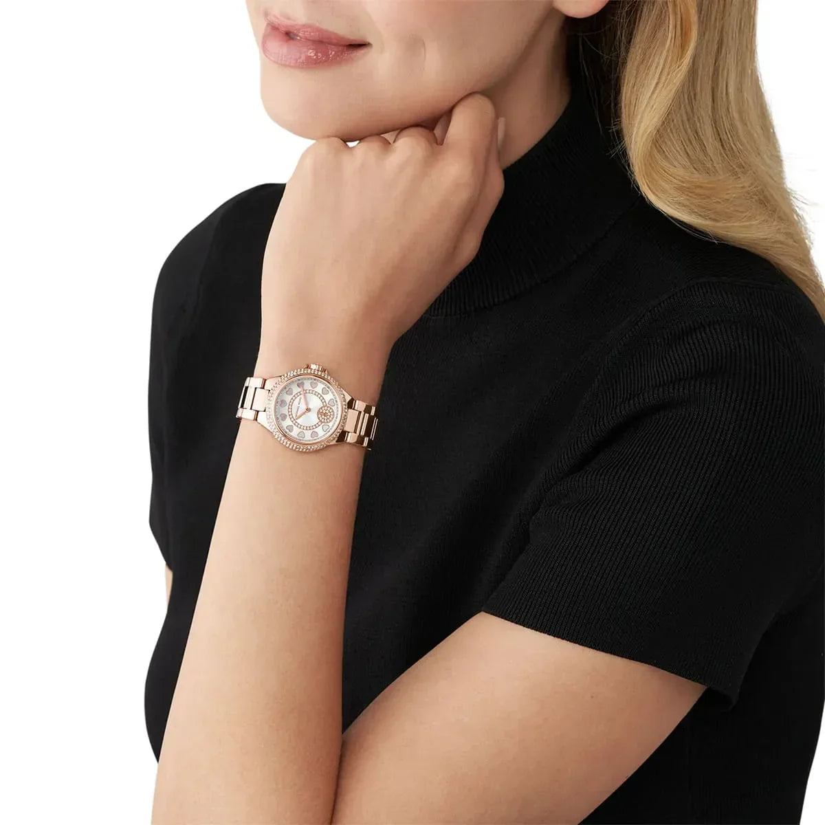 MK4700 rose gold watch worn on wrist showing crystal bezel and heart dial