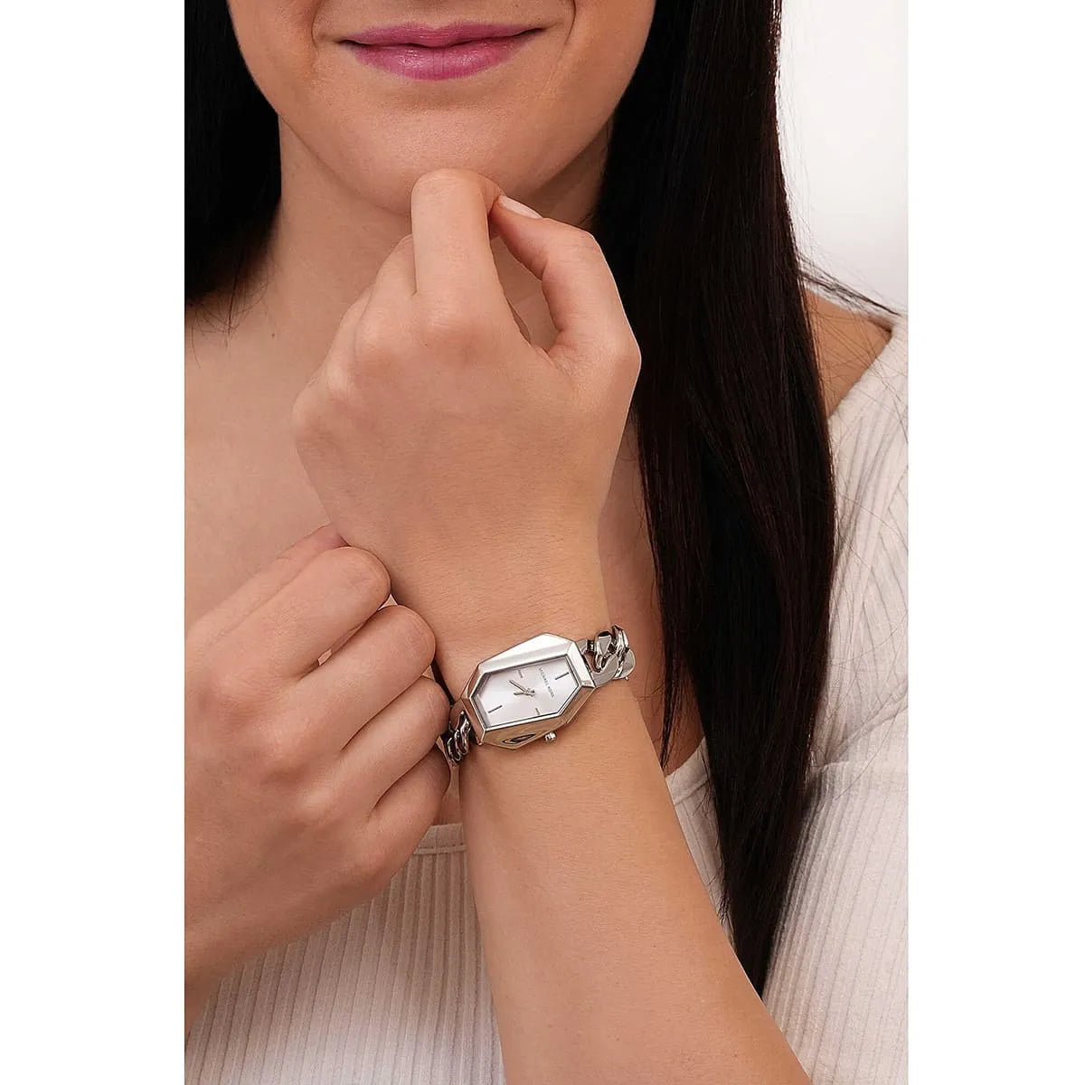 Michael Kors Mini Suri ladies watch worn on wrist with silver dial and chain strap
