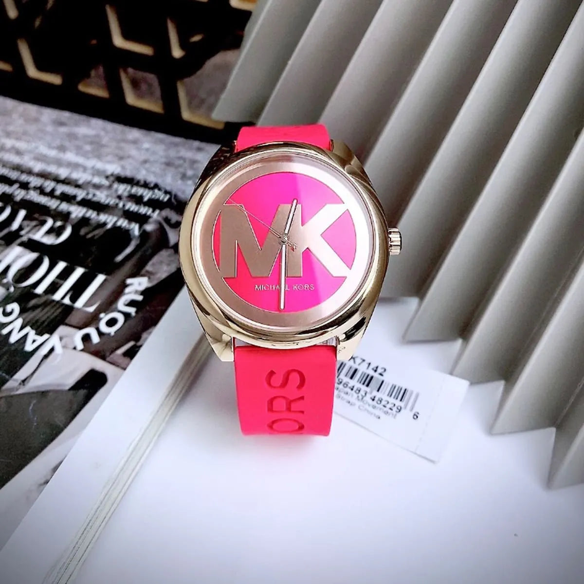 Michael Kors Janelle watch on-wrist with MK logo dial and red rubber strap