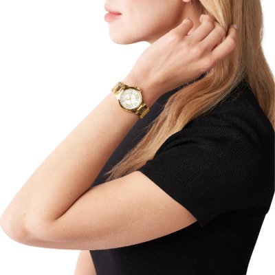 Michael Kors MK7255 Camille watch worn on wrist showing gold-tone case and dial