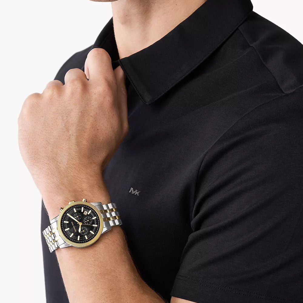 Michael Kors MK8954 two-tone chronograph watch worn on wrist with black dial visible