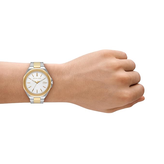 Michael Kors MKO1181 analogue watch worn on wrist showing two-tone strap and textured dial