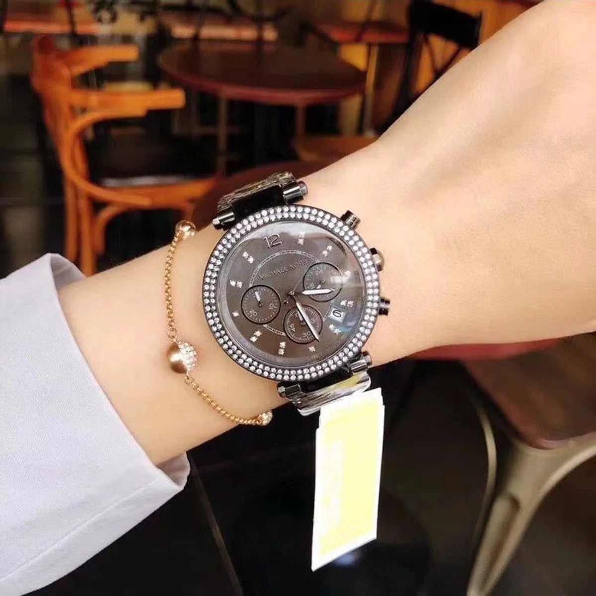 Michael Kors Parker MK6265 chronograph watch worn on wrist with crystal bezel detail