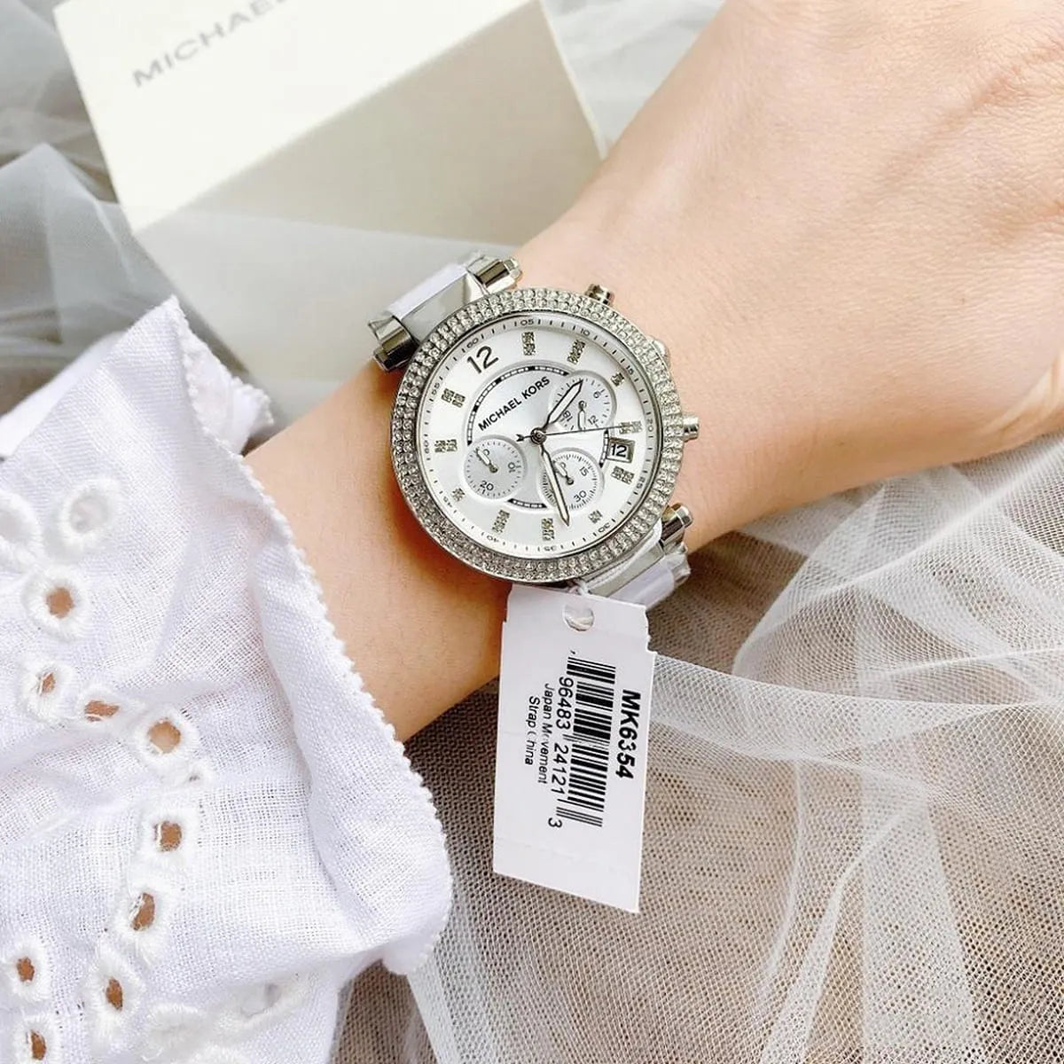 Michael Kors Parker MK6354 watch worn on wrist with crystal-set bezel and white strap
