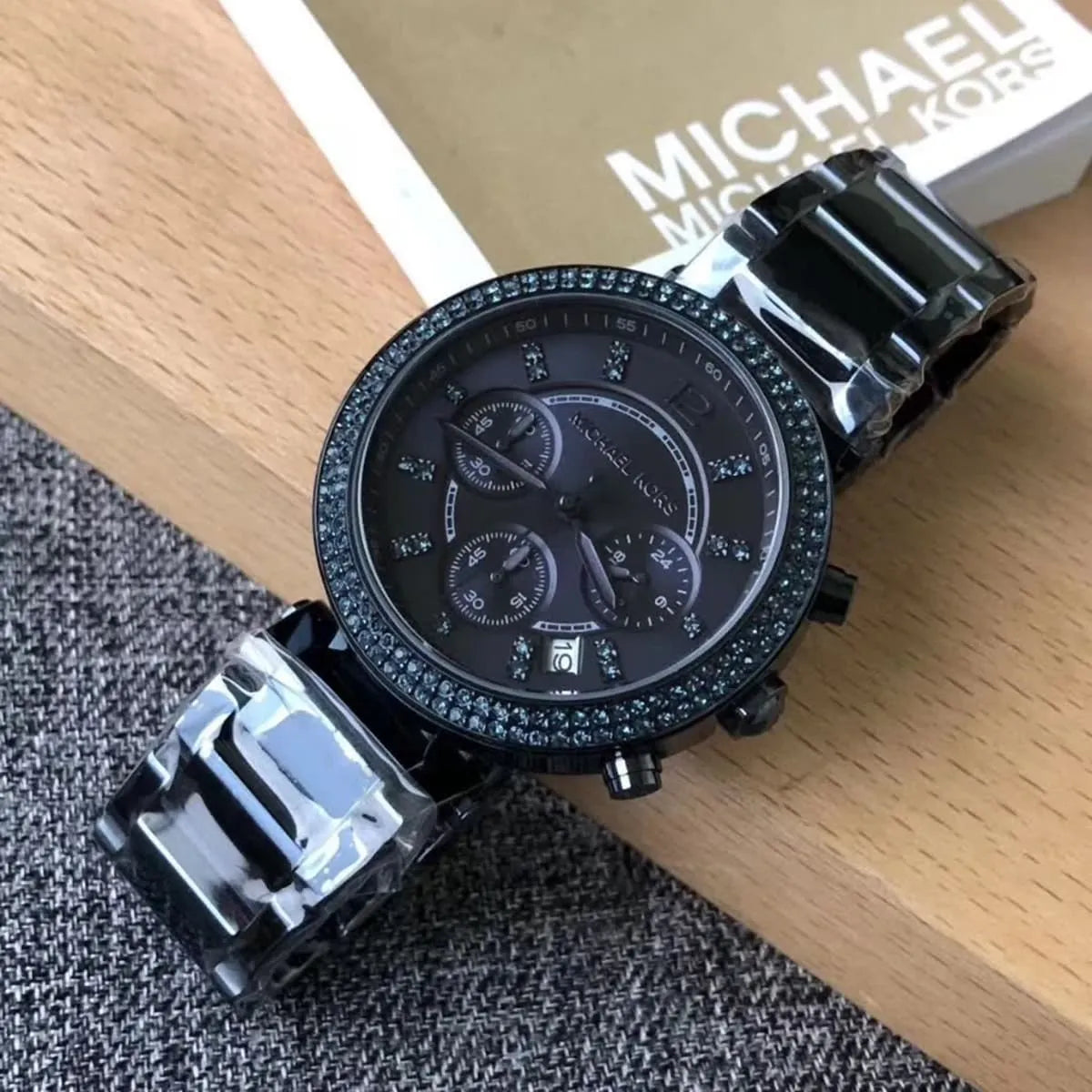 Michael Kors Parker MK6418 chronograph worn on wrist with crystal-set bezel