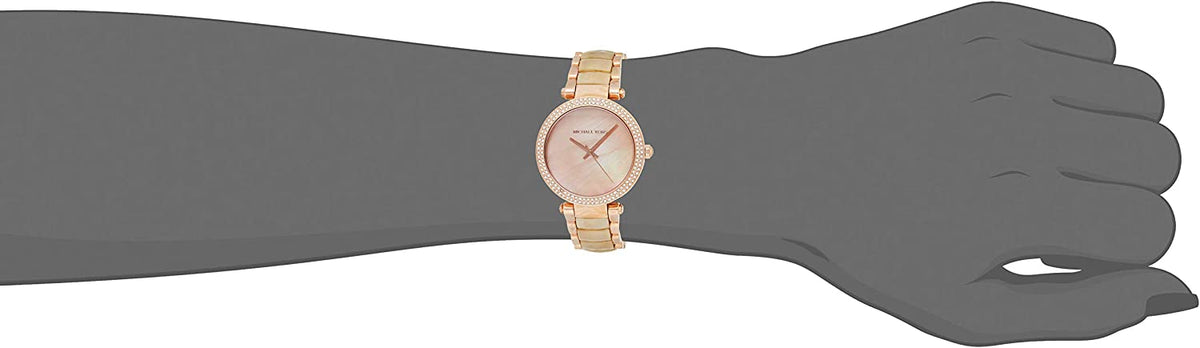 Michael Kors Parker watch worn on wrist showing rose gold case and cream bracelet