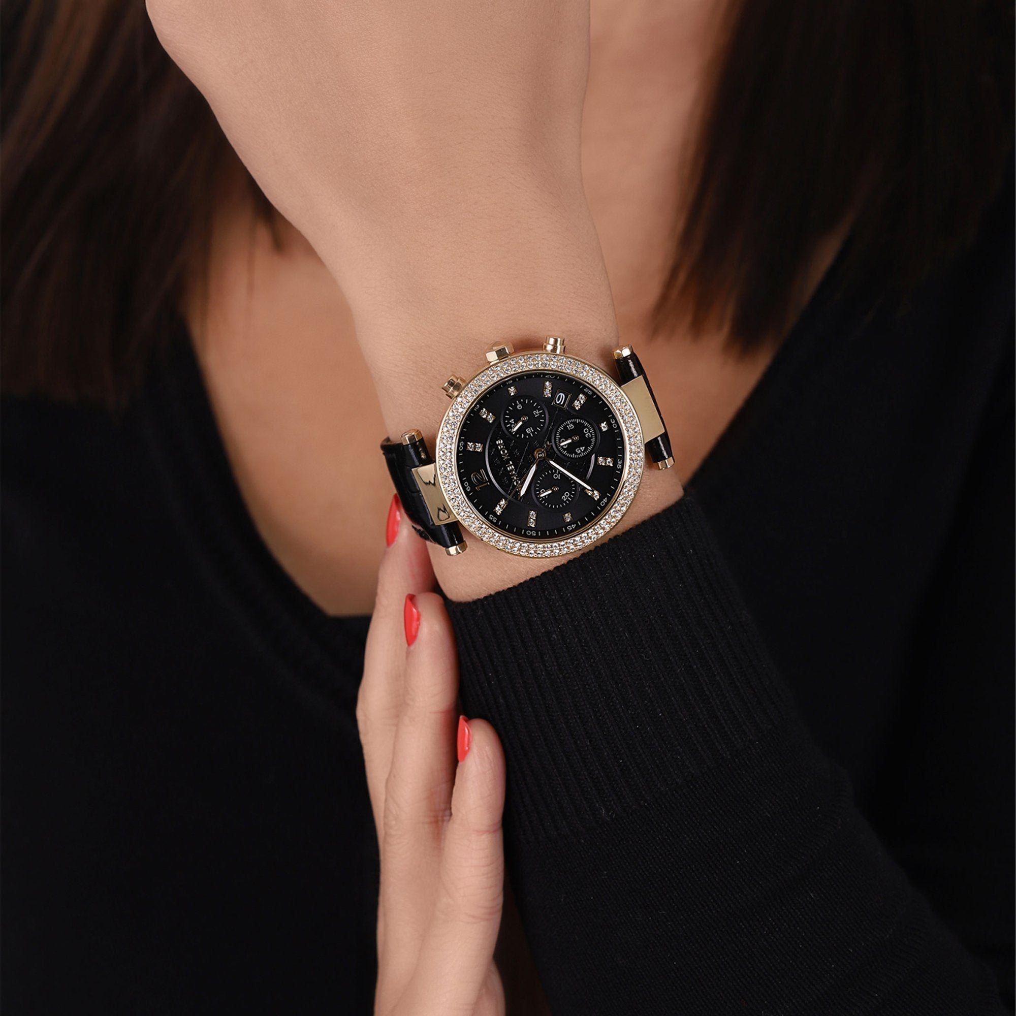 Michael Kors Parker chronograph watch worn on wrist showing black dial and crystal-set bezel detail