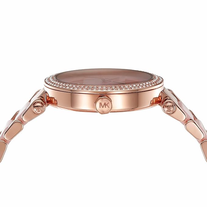 Side view of Michael Kors Parker watch showing rose gold case, bezel details, and link bracelet lugs