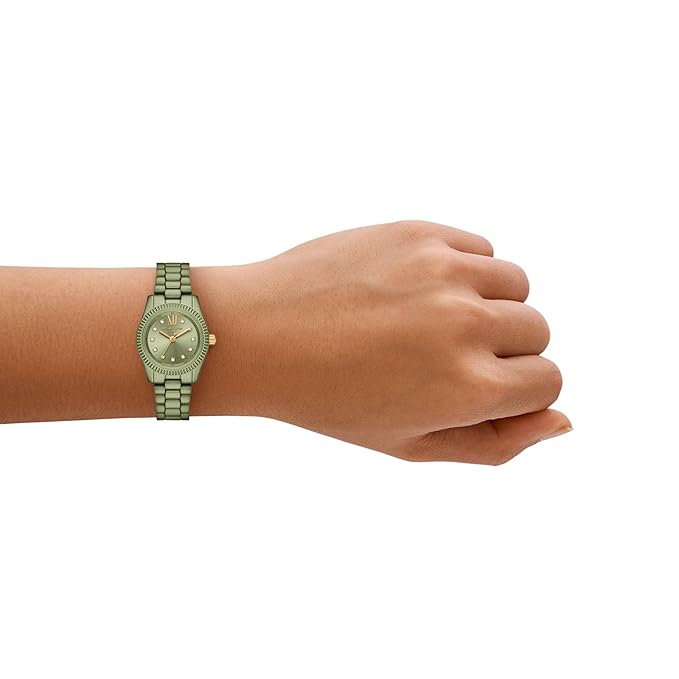 Michael Kors Petite Lexington green-tone watch worn on wrist showing green bracelet