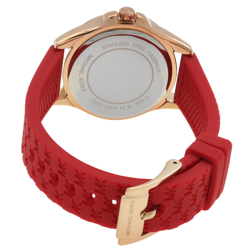 Michael Kors Pilot watch caseback showing stainless steel case with engraved text and red strap