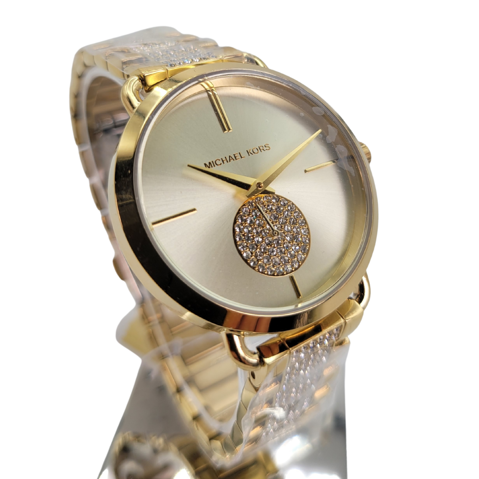 Michael Kors Portia gold-tone watch at angle showing crystal-embellished dial