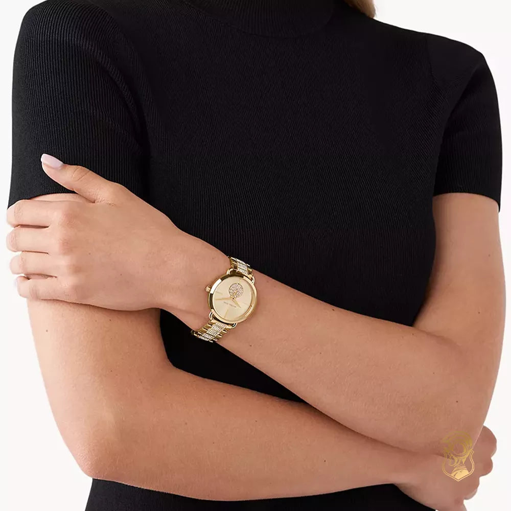 Michael Kors Portia gold-tone watch worn on wrist with crystal dial subdial