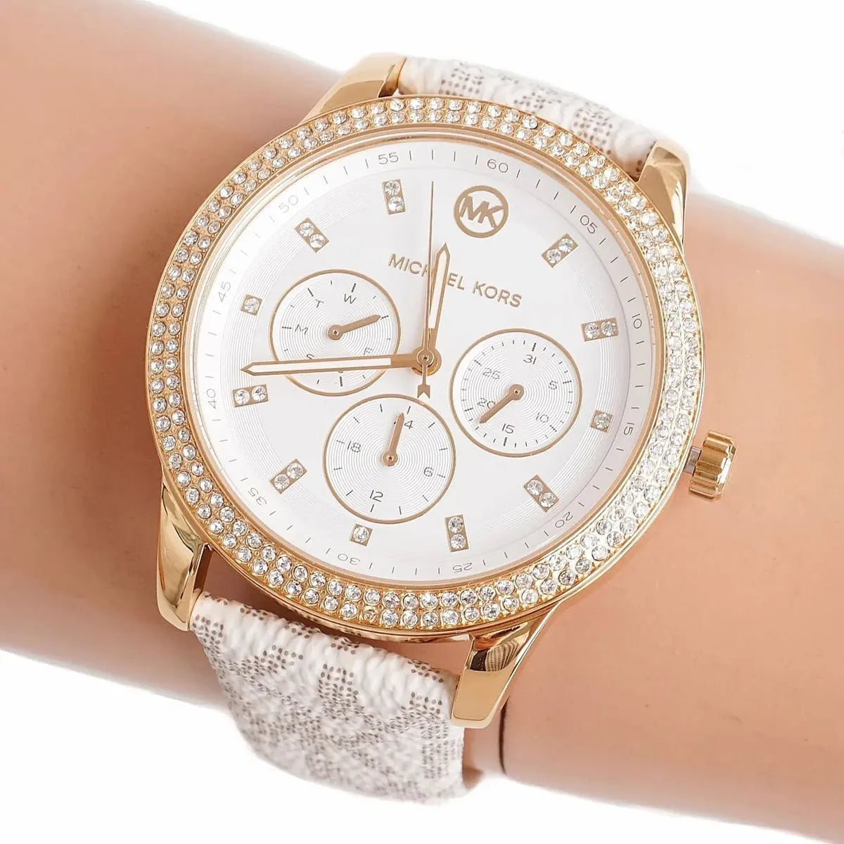 Michael Kors Tibby watch worn on wrist showing silver dial and crystal-set bezel