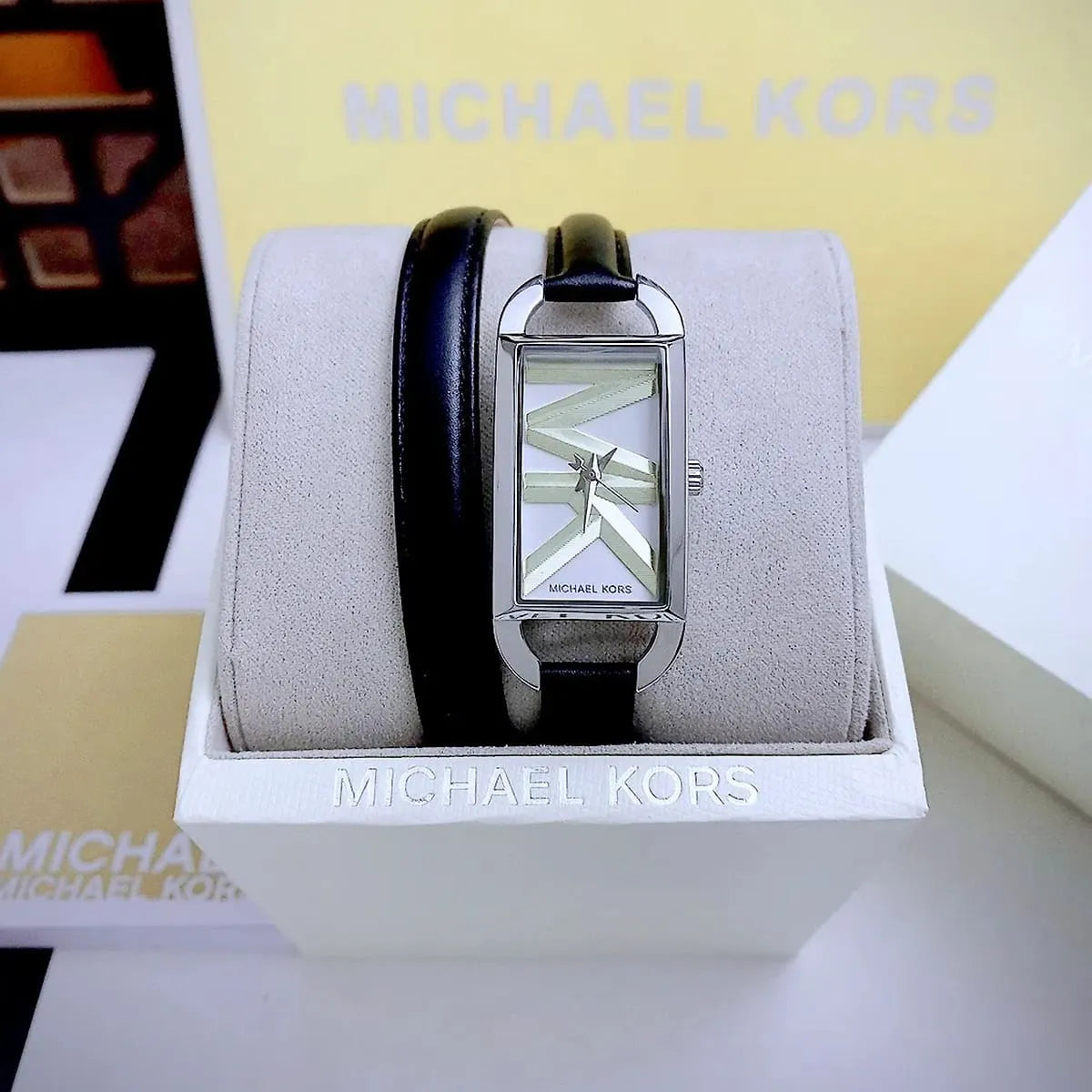 Michael Kors Mini Empire watch displayed in branded white retail box with packaging